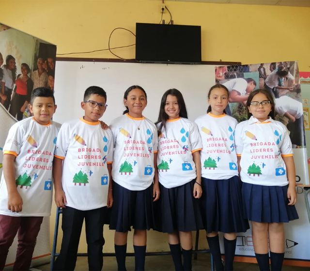 Woman in Awamaki program weaving