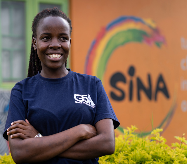Women in BOLT program looking at chart on wall