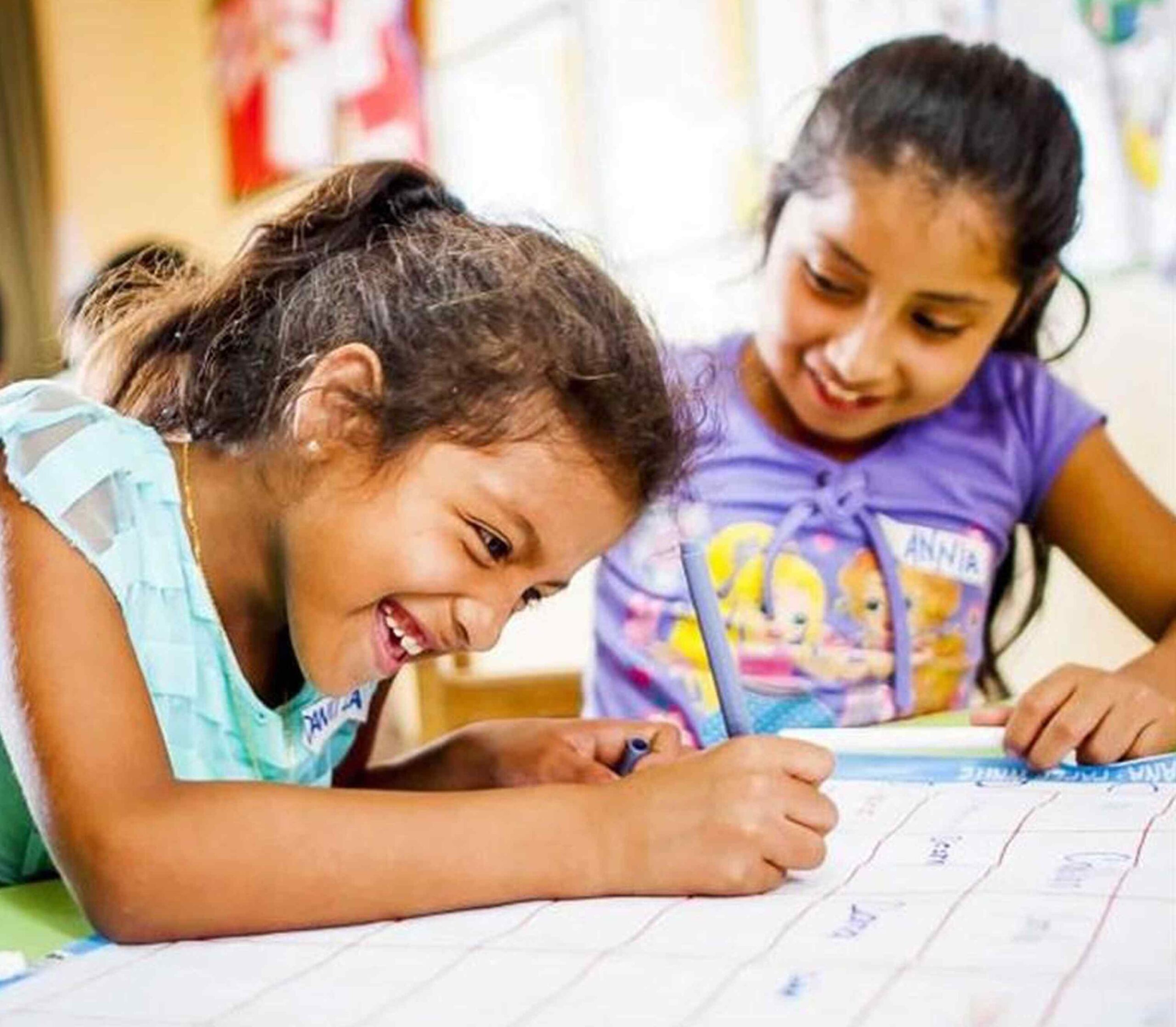 Girls in Kantaya program writing