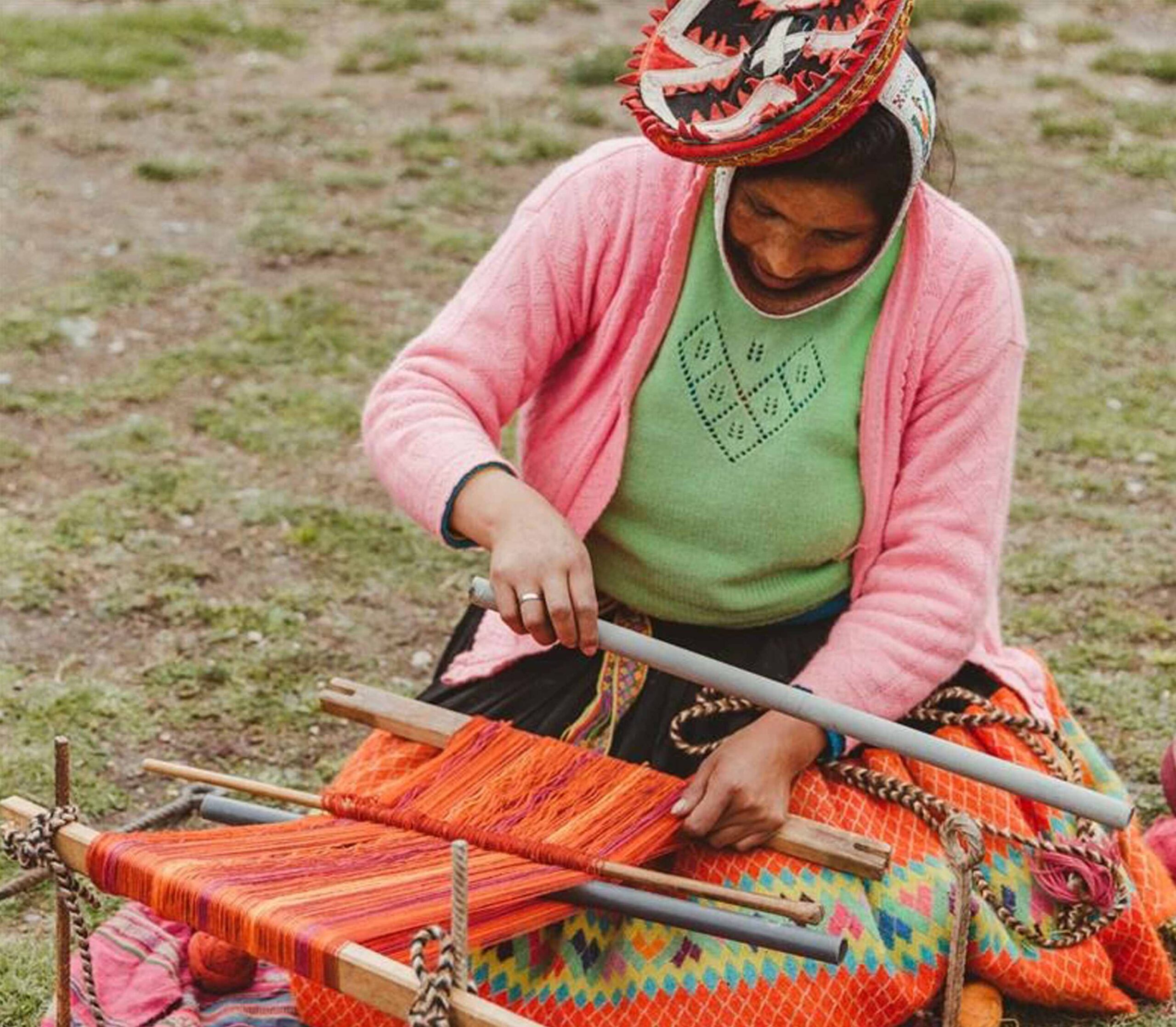 Woman in Awamaki program weaving