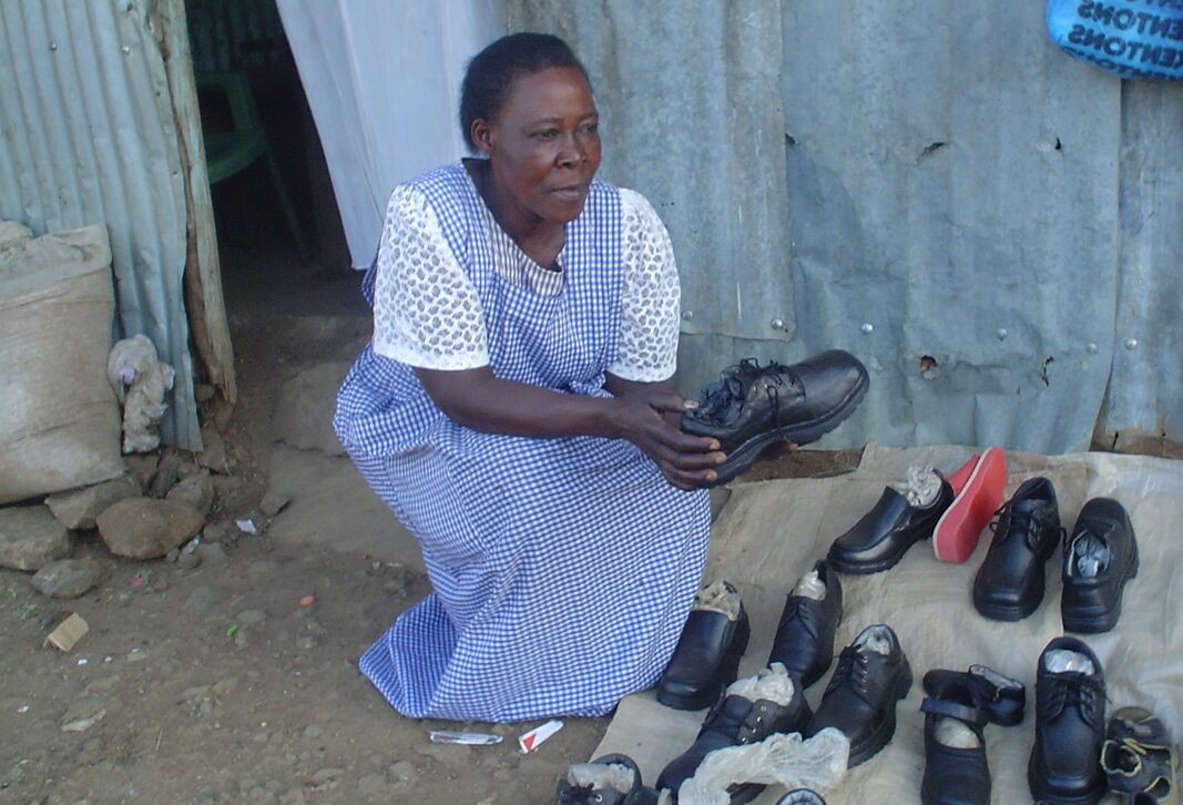 Woman selling shoes. 